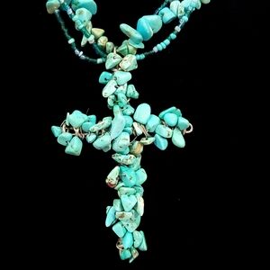 Turquoise cross necklace.